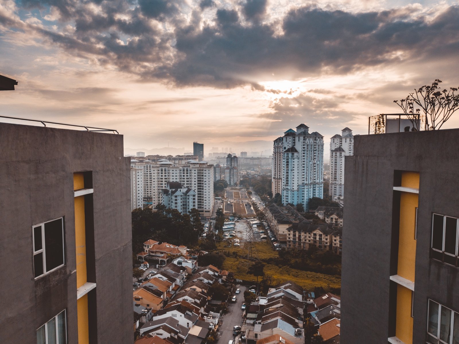 A beautiful shot of the Kuala Lumpur buildings under a cloudy sky at Malaysia